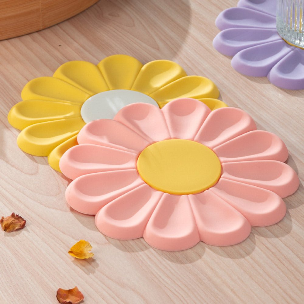 https://www.skoopmarket.com/cdn/shop/products/daisy-silicone-trivet-mat-pot-holder-for-hot-pot-pan-4-colors-set-219541_1200x.jpg?v=1664244106
